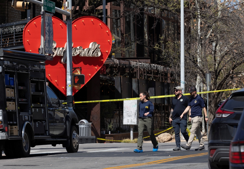 Law enforcement officers, including the FBI, investigate the scene after a deadly mass shooting outside Buford's, a popular roadhouse-style bar in Austin, Texas March 1, 2026. — Reuters pic