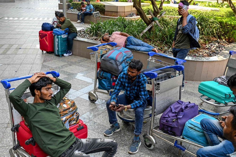 Stranded passengers wait at the departure terminal of Chhatrapati Shivaji Maharaj International Airport in Mumbai on March 1, 2026 after India's two largest private carriers IndiGo and Air India suspended flights to all destinations in the Middle East. — AFP pic 