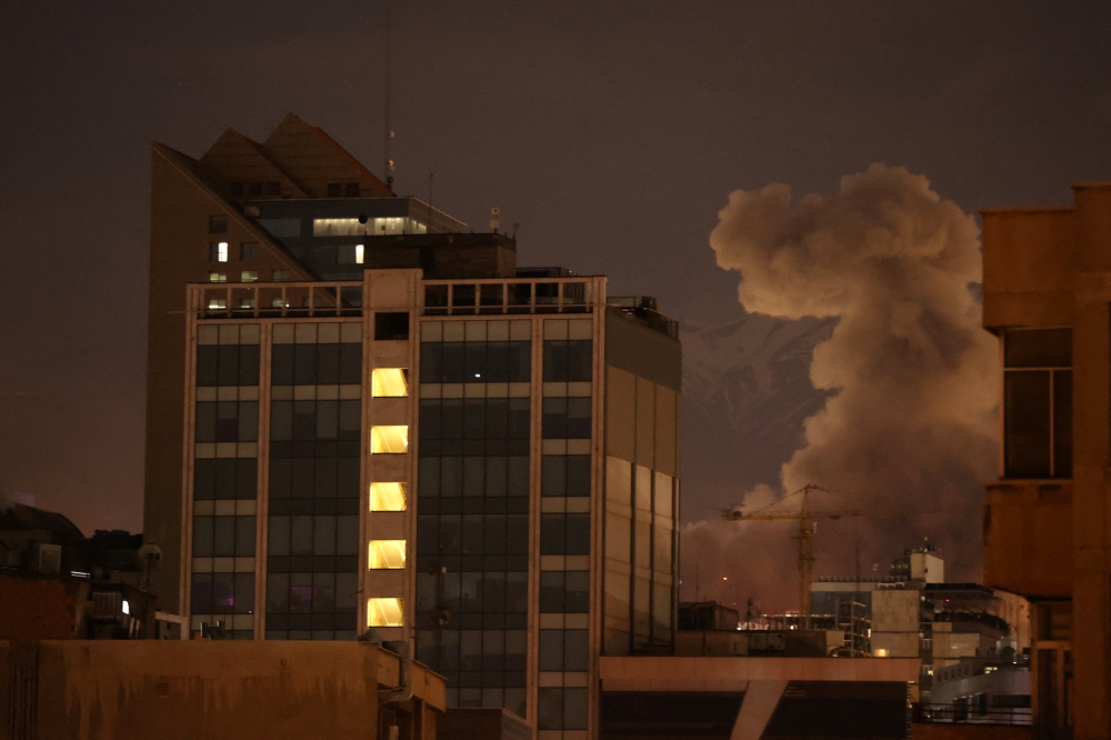 Smoke rises following an explosion, after Israel and the U.S. launched strikes on Iran, in Tehran March 1, 2026. — Reuters pic