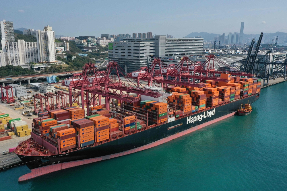 This photo shows an aerial view of a container ship docked at the Kwai Chung container terminal in Hong Kong on February 24, 2025. Six men suffered minor injuries after a suspected mechanical failure caused an explosion at a government dockyard in Hong Kong’s Stonecutters Island today. — AFP pic 