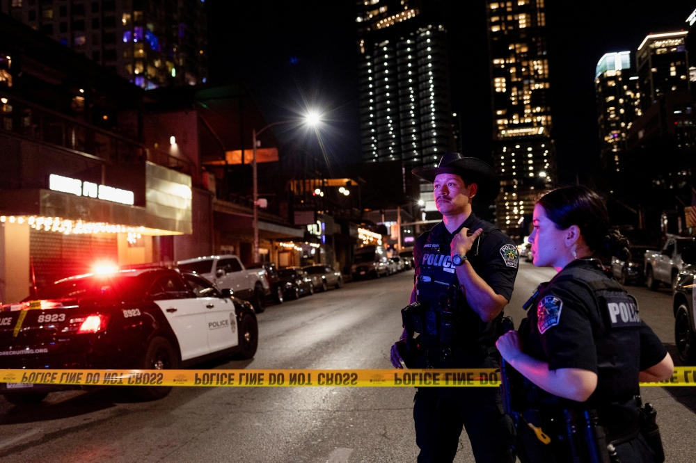 Austin police officers work at the scene after a deadly mass shooting outside Buford's, a popular roadhouse-style bar in Austin, Texas March 1, 2026. — Reuters pic  