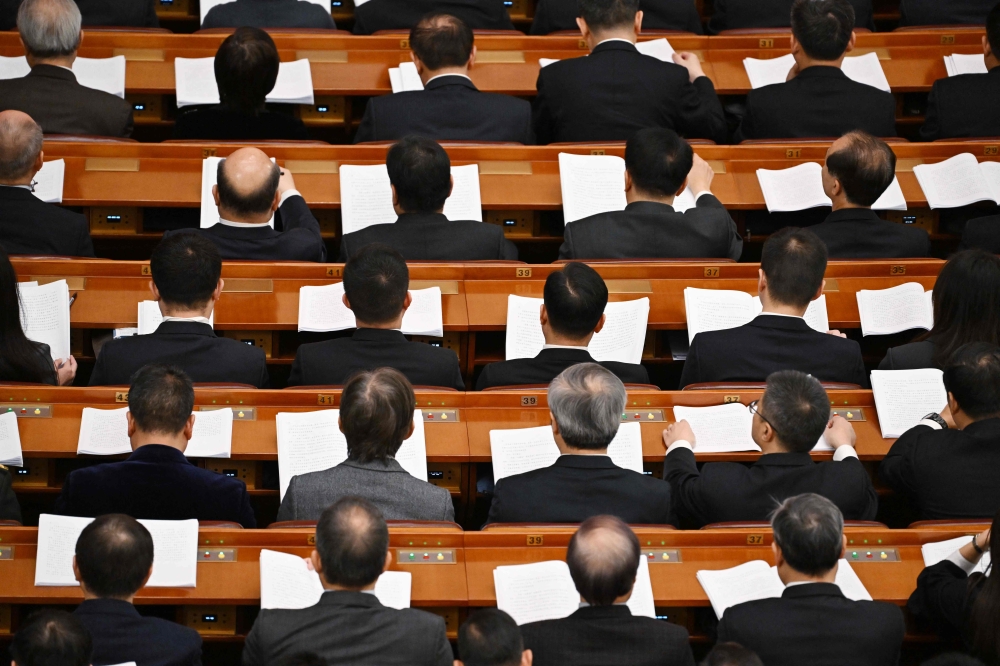 Delegates attend a plenary session of the Chinese People’s Political Consultative Conference at the Great Hall of the People in Beijing on March 9, 2024. — AFP pic