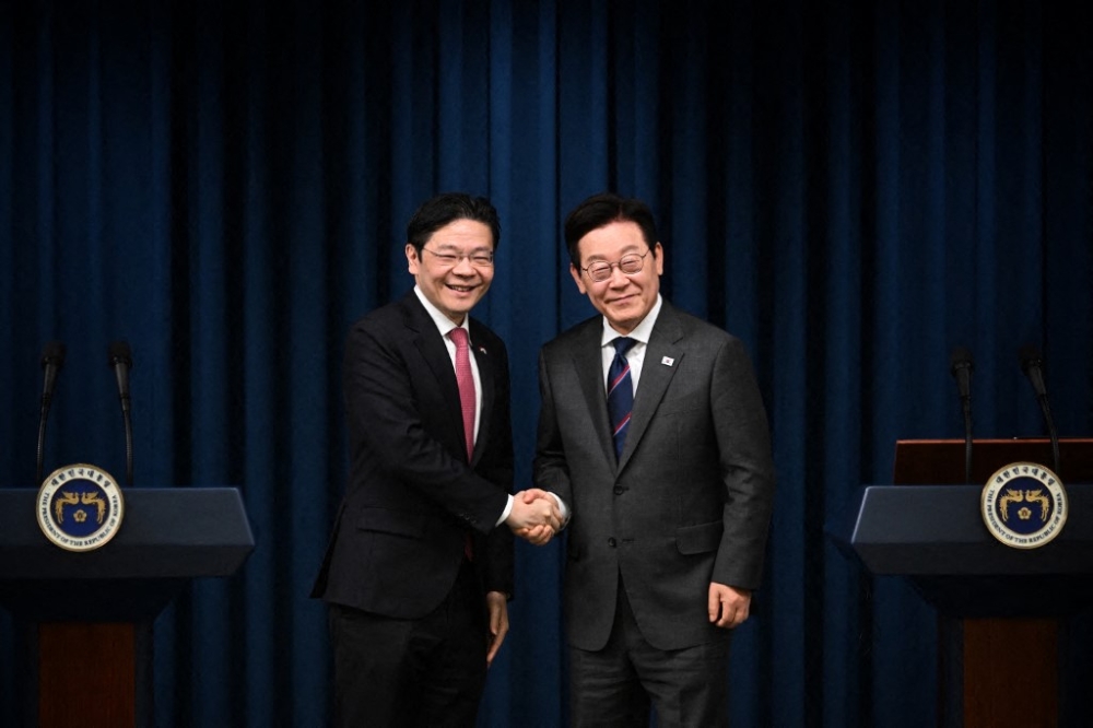 Singapore Prime Minister Lawrence Wong and South Korea President Lee Jae Myung holding a joint press conference during the visit, 2 November 2025. PM Wong's visit was from 29 October to 2 November. — Chong Jun Liang/ST/SPH Media pic via AFP