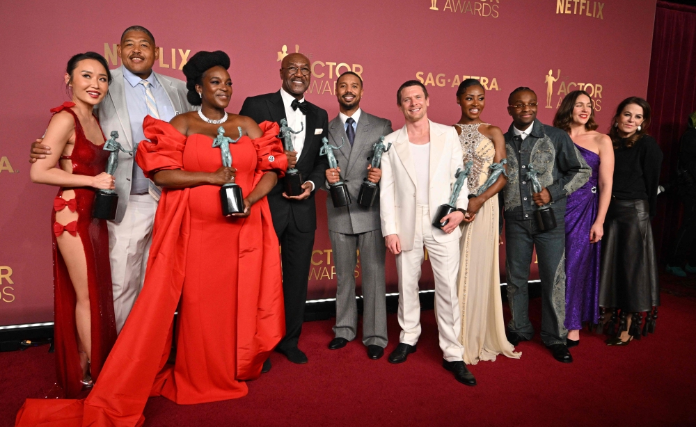 Chinese-US actress Li Jun Li, US actor Omar Miller, Nigerian-British actor Wunmi Mosaku, British actor Delroy Lindo, US actor Michael B. Jordan, British actor Jack O'Connell, US actress singer songwriter Jayme Lawson, US actor Miles Caton, and US casting director Francine Maisler pose with the Outstanding Performance by a Cast in a Motion Picture for 