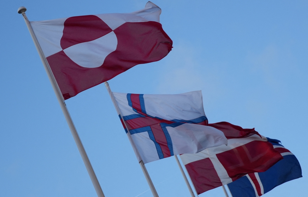The flags of Greenland, the Faroe Islands, Denmark and Iceland flutter outside North Atlantic House in Copenhagen, Denmark, January 14, 2026. — Reuters pic 