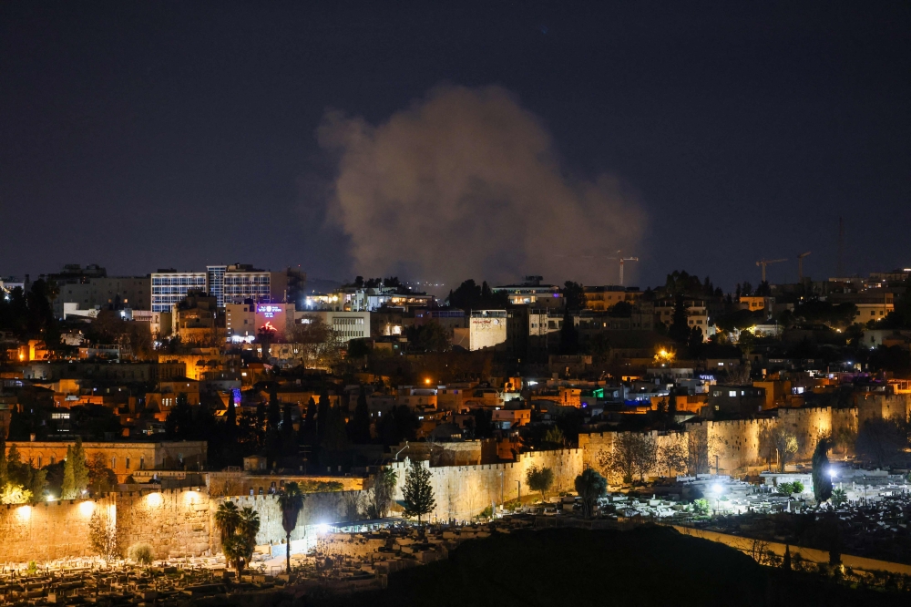 Smoke rises from an explosion during interception over Jerusalem on March 1, 2026. Iran’s Revolutionary Guards said today they had launched missile strikes on an Israeli government complex in Tel Aviv as well as security and military centres in Haifa and an attack on east Jerusalem. — AFP pic