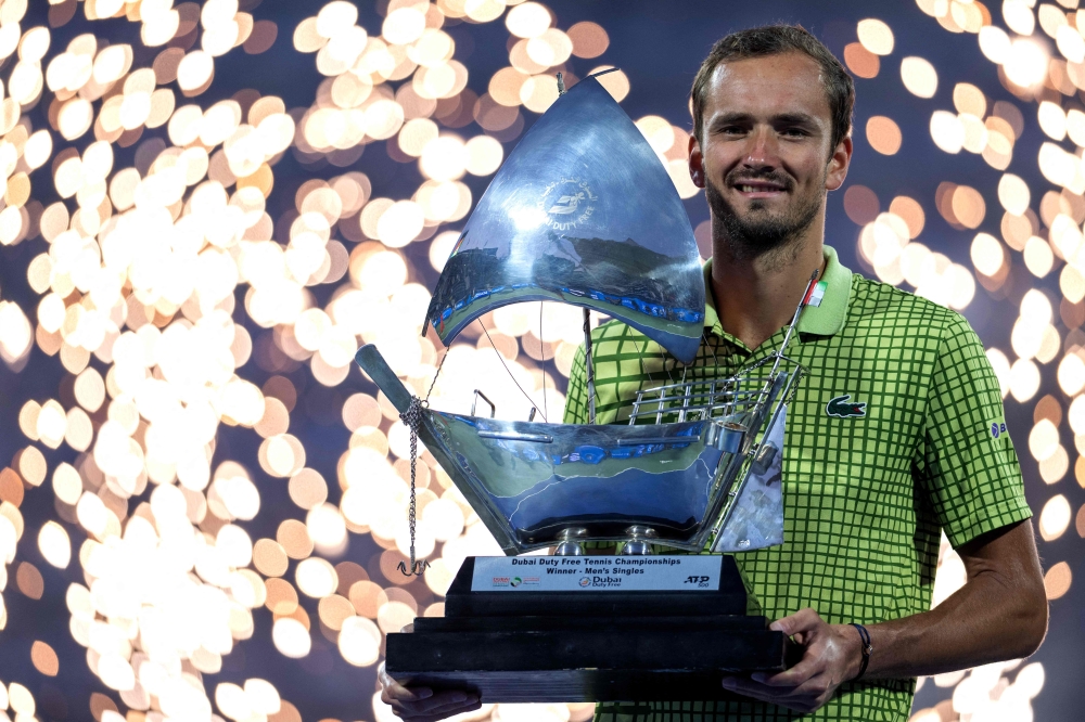 Russia’s Daniil Medvedev celebrates with the trophy after winning his men’s singles final match against Netherlands’ Tallon Griekspoor at the Dubai Duty Free Tennis tournament in Dubai February 28, 2026. — AFP pic