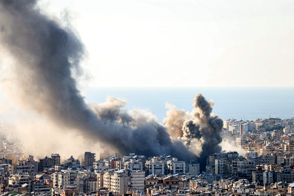 Smoke plumes billow following Israeli bombardment on Beirut’s southern suburbs on March 2, 2026. — AFP pic