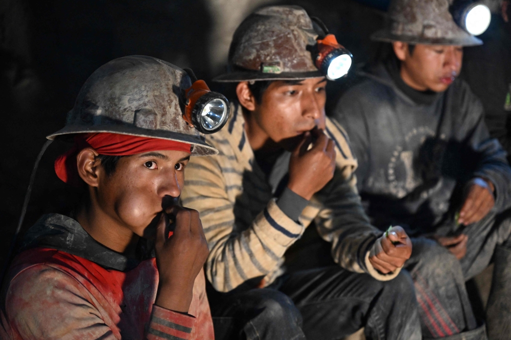 Miners chew coca leaves during a break inside a tunnel of the Rosario Bajo Cooperativa Minera on Cerro Rico, in the Potosi Department, in southern Bolivia on February 19, 2026. — AFP pic