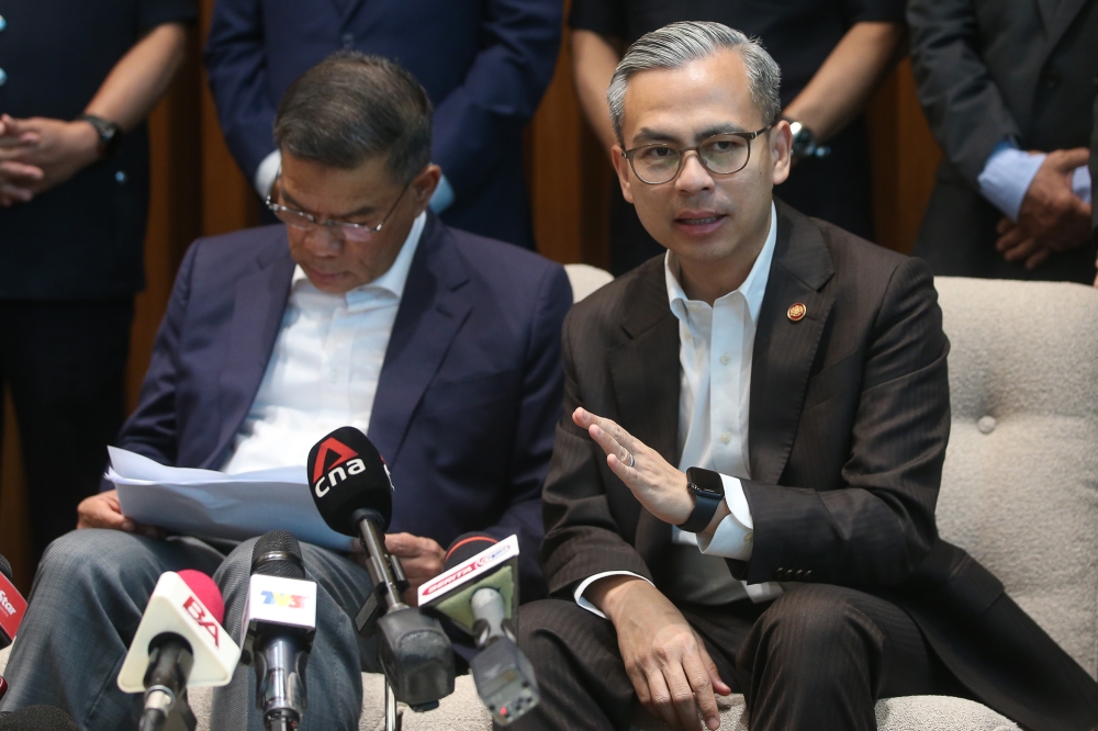 Communications Minister Datuk Fahmi Fadzil (left) speaks at a joint press conference with Home Minister Datuk Seri Saifuddin Nasution Ismail at Menara 2 MCMC in Cyberjaya, March 3, 2026 — Picture by Yusof Isa