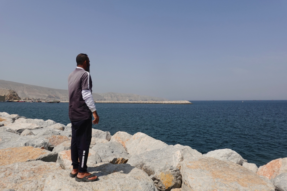 A man looks toward the Strait of Hormuz amid the US-Israeli conflict with Iran, in Musandam, Oman, March 2, 2026. — Reuters pic