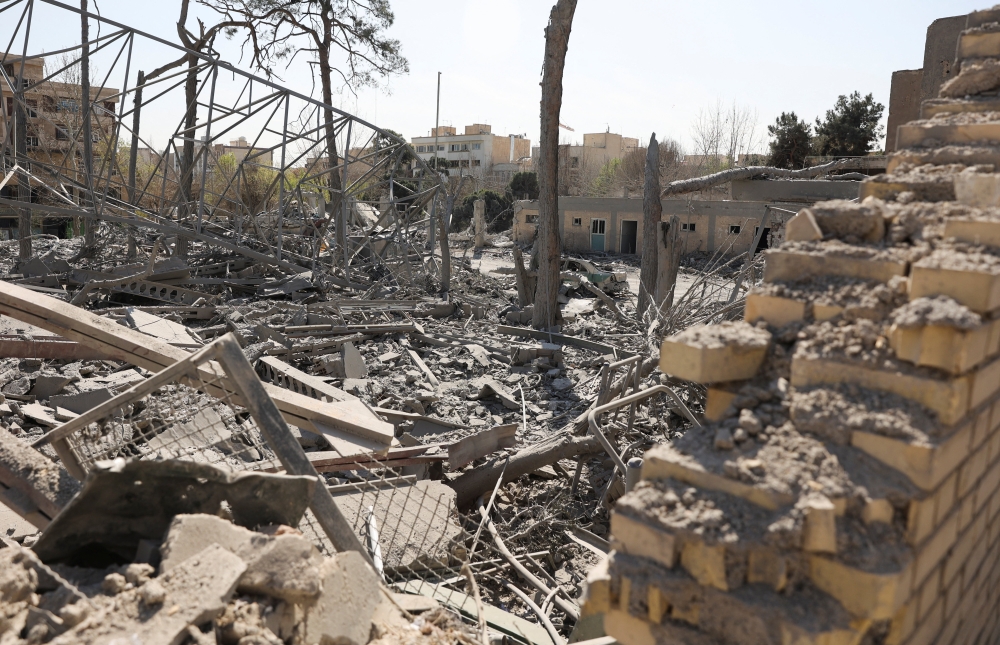 A destroyed police car stands amid rubble in the aftermath of a strike on a police station, amid the U.S.-Israeli conflict with Iran, in Tehran March 4, 2026. — Majid Asgaripour/Wana (West Asia News Agency) pic via Reuters