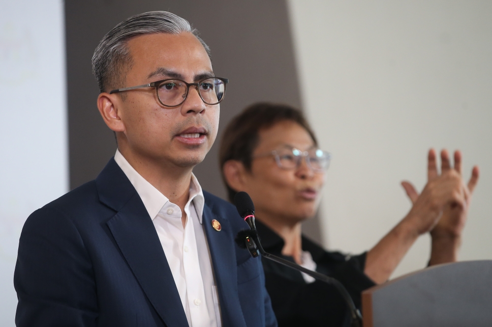Communications Minister Datuk Fahmi Fadzil said no action has been taken so far against MPs absent during the vote on the proposed 10-year prime minister term limit, with two having submitted explanations and six yet to do so. — Picture by Yusof Isa