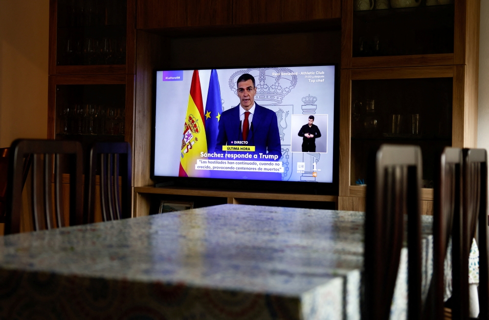 A TV screen shows a live broadcast of Spain’s Prime Minister Pedro Sanchez, as he delivers an institutional statement to address the latest international developments, after US President Donald Trump said on Tuesday that the US would cut off all trade with Spain after the European country refused to let the US military use its bases for missions linked to strikes on Iran, at a house in Ronda, Spain, March 4, 2026. — Reuters pic 