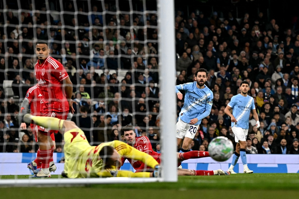 Manchester City’s Portuguese midfielder #20 Bernardo Silva shoots but has the shot saved during the English Premier League football match between Manchester City and Nottingham Forest at the Etihad Stadium in Manchester, on March 4, 2026. — AFP pic 