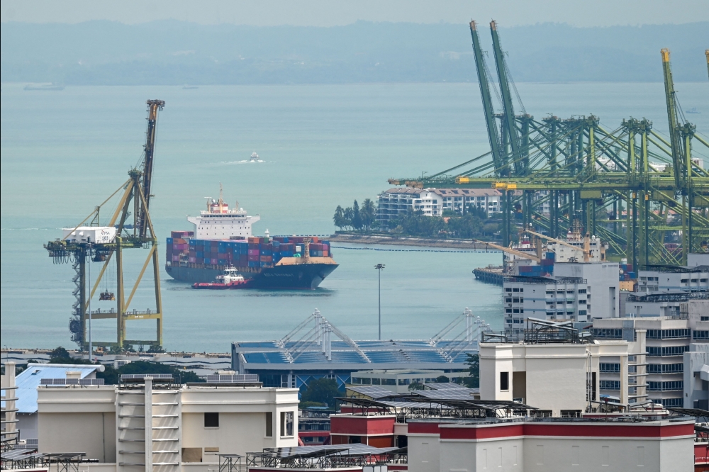 A container vessel leaves the Pulau Brani port terminal in Singapore on February 27, 2026. Singapore is developing a maritime master plan to strengthen its competitiveness as a leading global hub port and international maritime centre, Senior Minister of State for Transport Murali Pillai said on Wednesday. — AFP pic 