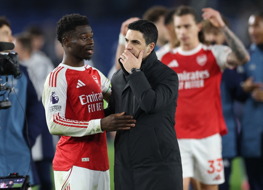 Arsenal’s Bukayo Saka and manager Mikel Arteta celebrate after the match against Brighton & Hove Albion at The American Express Community Stadium, Brighton, March 4, 2026. — Action Images pic via Reuters