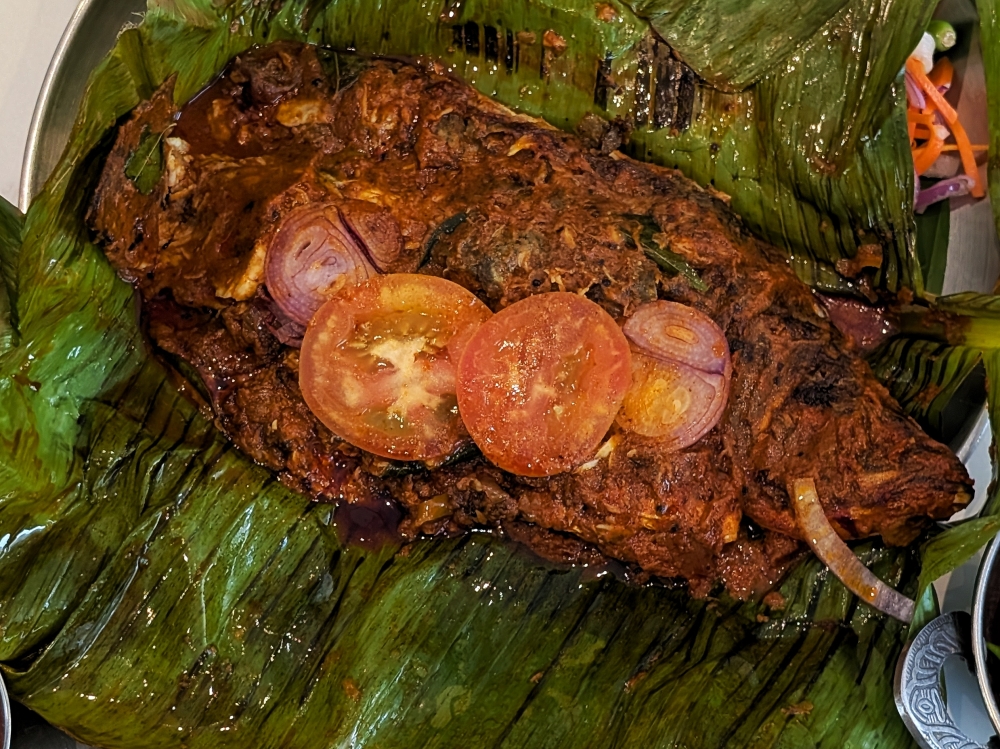 Between a choice of threadfin and seabass for the Elayil Pollicha Meen, the latter is slightly pricier but it does offer more buttery flesh. — Picture by Ethan Lau