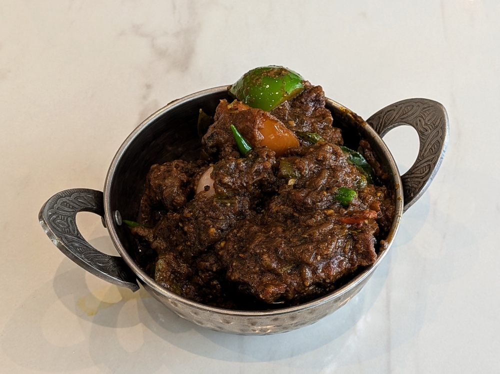 Chacko’s chicken pepper roast was the most fiery thing we tried for lunch. — Picture by Ethan Lau