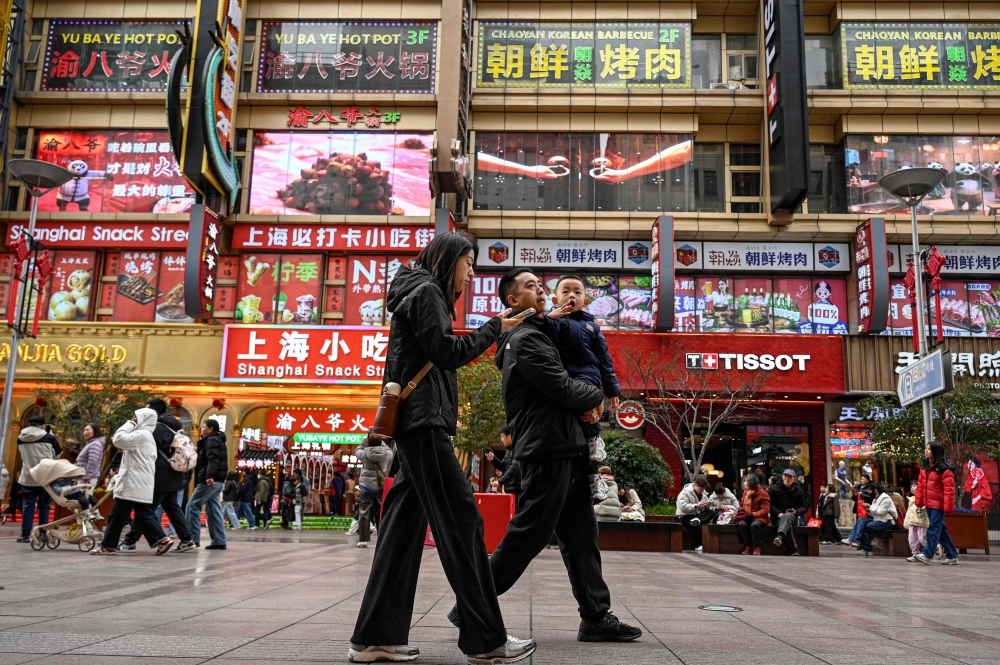 People walk on the Nanjing Road Pedestrian Street in Shanghai on March 4, 2026. — AFP pic 