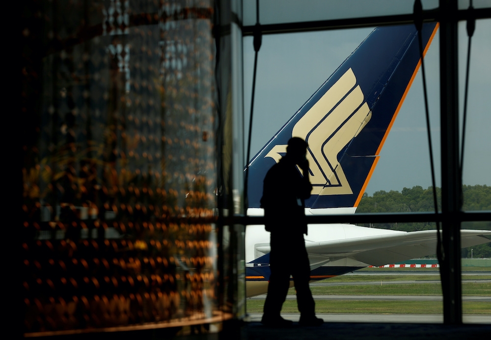 Singapore Airlines plane on Changi tarmac March 11, 2020. Minister Gan Siow Huang said MFA is working with airlines and local authorities to explore more repatriation flights amid airport reopenings. — Reuters pic