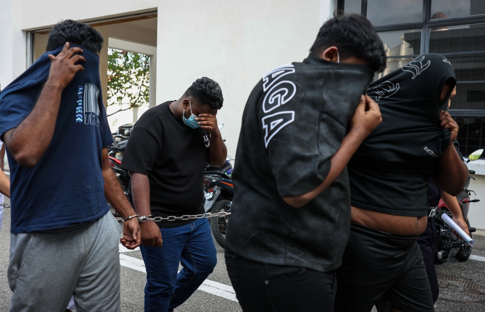 Four men pleaded not guilty in the Sessions Court here today to a charge of conspiring to cause grievous bodily harm to a man using a machete last week. — Bernama pic