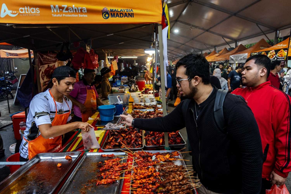 Rising ingredient and stall costs have driven price hikes at Ramadan bazaars, leaving some customers questioning whether the food is now too expensive. — Picture by Firdaus Latif