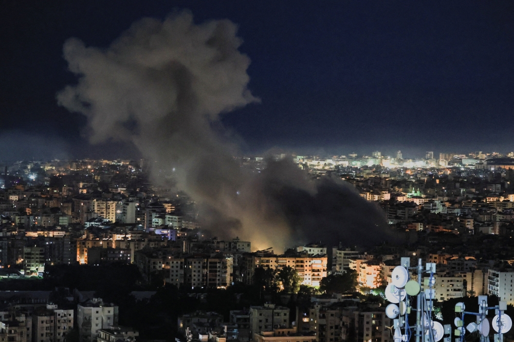 Smoke billows following strikes on Beirut’s southern suburbs, following an escalation between Hezbollah and Israel amid the US-Israeli conflict with Iran, as seen from Baabda, Lebanon, March 5, 2026. — Reuters pic