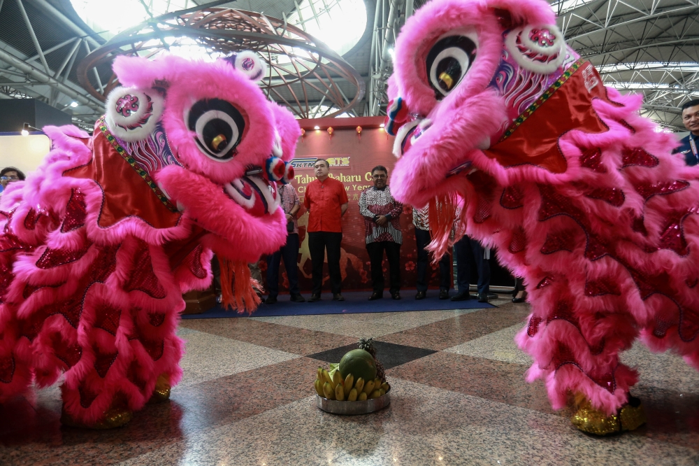 Transport Minister Anthony Loke watches a lion dance routine at KL Sentral in Kuala Lumpur February 14, 2026, ahead of his trip to Seremban in conjunction with Chinese New Year. — Picture by Sayuti Zainudin