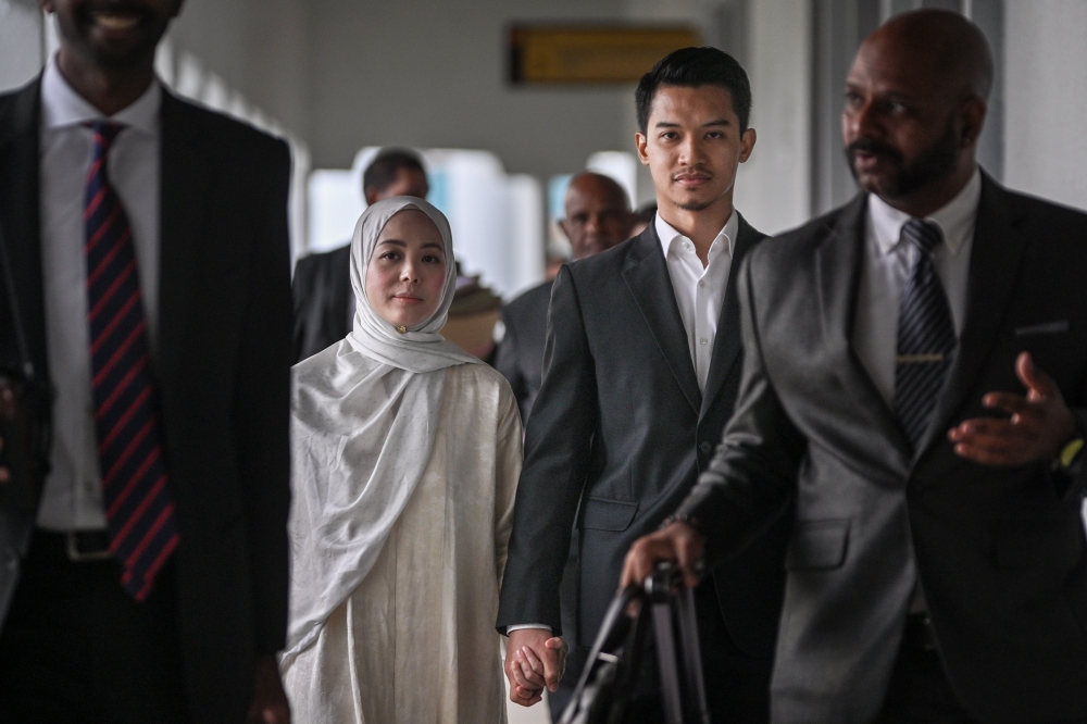 FashionValet founder Datin Vivy Yusof, and her husband Datuk Fadzarudin Shah Anuar arrive at the Kuala Lumpur Sessions Court March 6, 2026. — Bernama pic