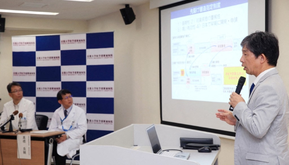 Jun Takahashi (right), professor of center for iPS Research and Application, attends a press conference at Kyoto University in Kyoto City on July 30, 2018. Kyoto University officially announced on March 6, 2026 that they will begin a clinical trials of transplanting cells that form nerve cells made from artificial pluripotent stem cells (iPS cells) into the brains of Parkinson’s disease patient from August 1, 2026. — The Yomiuri Shimbun pic via AFP
