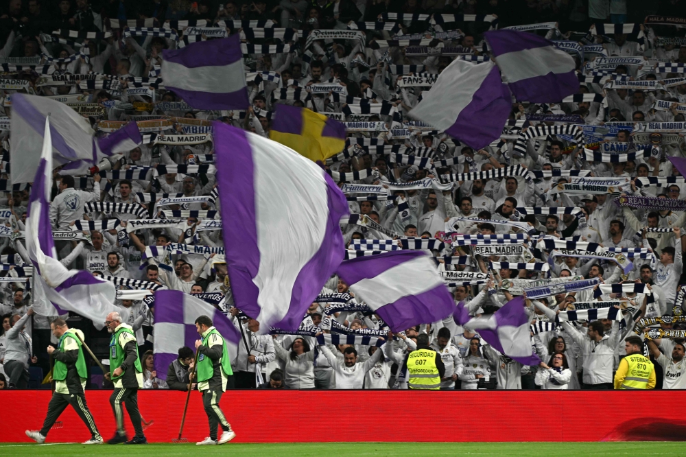 Real Madrid fans cheer before the Spanish league football match between Real Madrid CF and Getafe CF at Santiago Bernabeu Stadium in Madrid on March 2, 2026. Real Madrid was fined €15,000 after a fan was spotted performing a Nazi salute during their Champions League playoff second leg match against Benfica last week, Uefa said on Friday. — AFP pic 