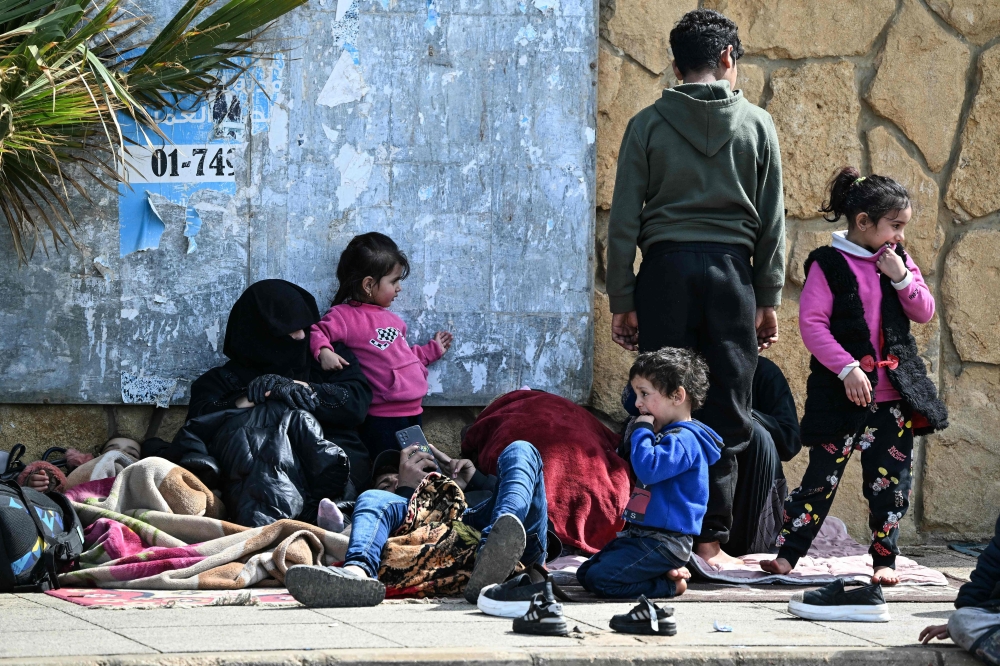 Residents who fled Israeli airstrikes in Beirut’s southern suburbs sit along the corniche waterfront in the Lebanese capital on March 6, 2026. Fresh strikes rocked Iran and Lebanon on March 6, as Israel vowed to escalate to a new phase in the Middle East war that has spiralled rapidly throughout the region and beyond. — AFP pic 