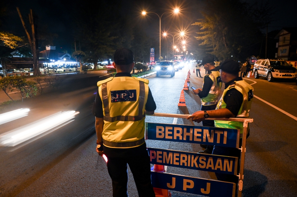 A 13-year-old boy was stopped by JPJ officers in Kedah while driving a Perodua Kancil with his father in the passenger seat. — Bernama file pic