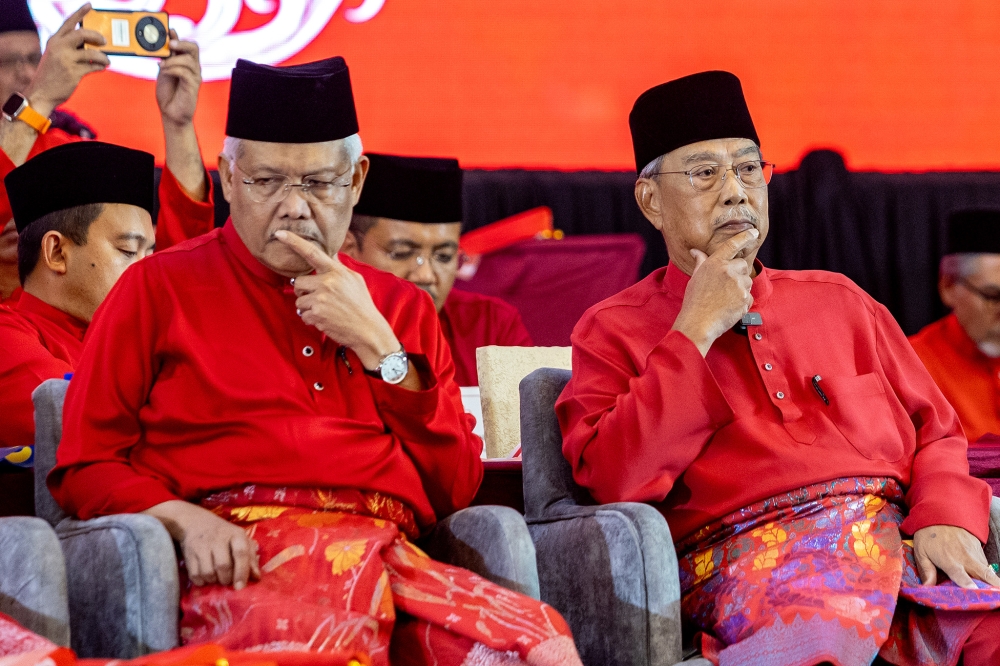 Then Bersatu deputy president Datuk Seri Hamzah Zainudin and Bersatu president Tan Sri Muhyiddin Yassin attend the party’s annual general meeting at Ideal Convention Centre (IDCC) in Shah Alam September 6, 2025. — Picture by Firdaus Latif