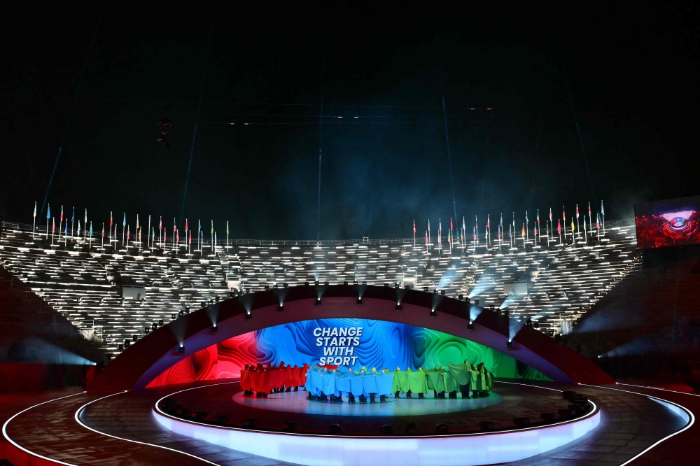Performs stand on stage to represent the Paralympic symbol Agitos during the Milano Cortina 2026 Winter Paralympic Games opening ceremony at Arena di Verona in Verona on March 6, 2026. — AFP pic 