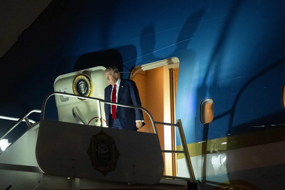 US President Donald Trump disembarks from Air Force One upon arrival at Miami International Airport in Miami, Florida, on March 6, 2026. President Trump will host the ‘Shield of the Americas’ summit with Latin American leaders focusing on security and democracy today in Doral, Florida. — AFP pic 