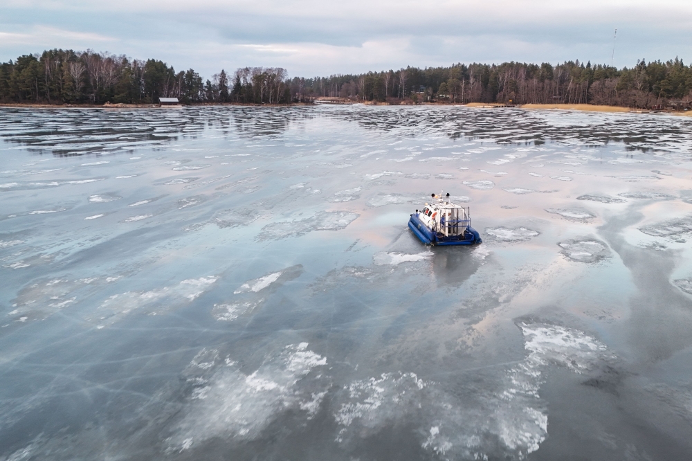 A hovercraft used to bring home kids from school glides on the ice of the Finnish archipelago on March 3, 2026, in Pargas, Finland. — AFP pic