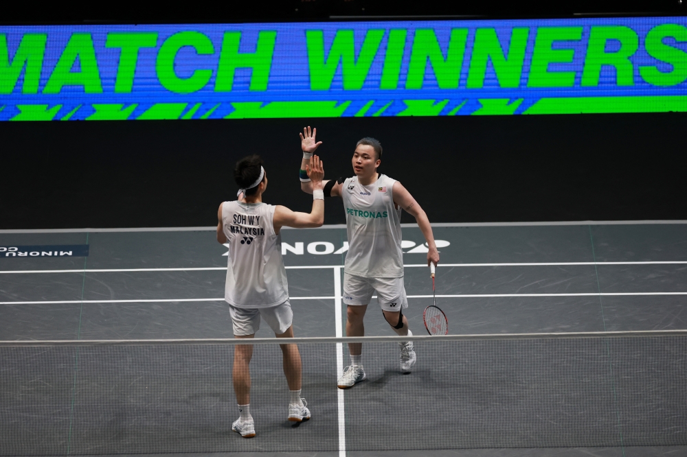 Malaysia’s Aaron Chia and Soh Wooi Yik celebrate after winning their men’s doubles semi-final match against China’s Chen Bo Yang and Liu Yi at the All England Open at Utilita Arena Birmingham in Birmingham on March 7, 2026. — Reuters pic