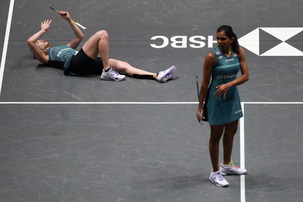 Malaysia’s Pearly Tan and Thinaah Muralitharan react during their women’s doubles semi-final match against South Korea’s Lee So-hee and Baek Ha-na at the All England Open at Utilita Arena Birmingham in Birmingham on March 7, 2026. — Reuters pic