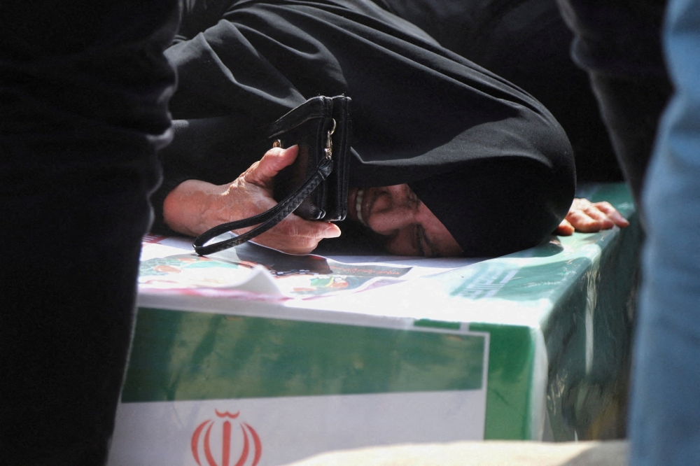A woman reacts during the funeral of victims in Minab, Iran on March 3, 2026. — Reuters pic