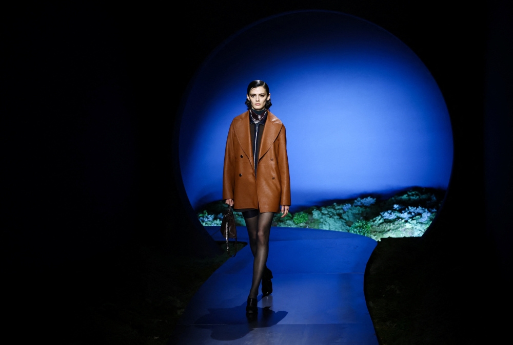 Hermes designer Nadege Vanhee took inspiration from ‌the ambience of twilight for a fall/winter collection featuring fluid leather coats, zip-front mini dresses, and biker shorts. — Reuters pic