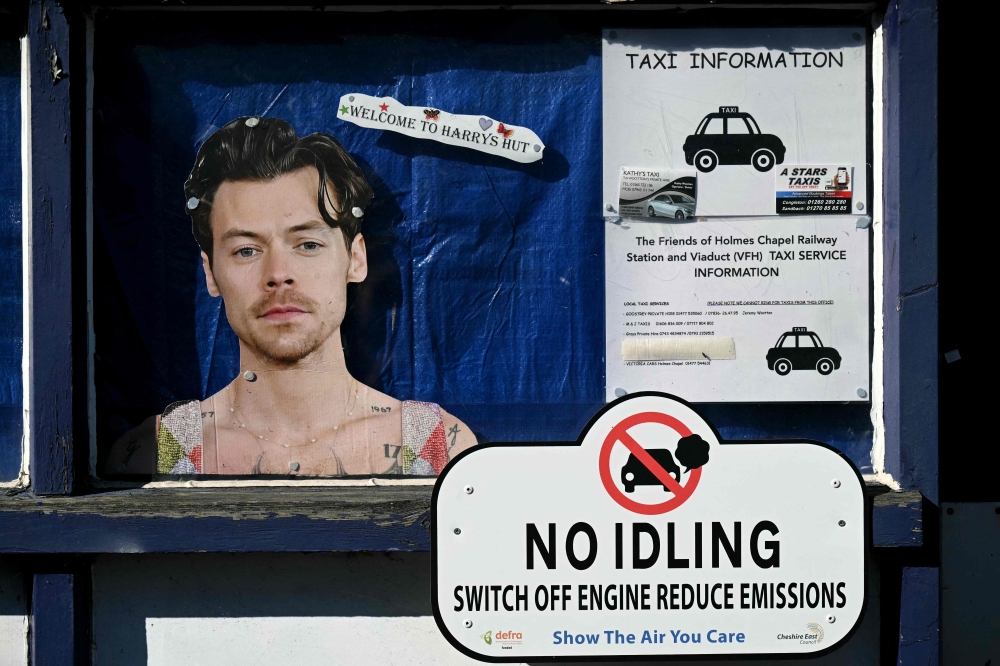 A poster of English singer Harry Styles at the train station in Holmes Chapel, north west England, on March 4, 2026. — AFP pic