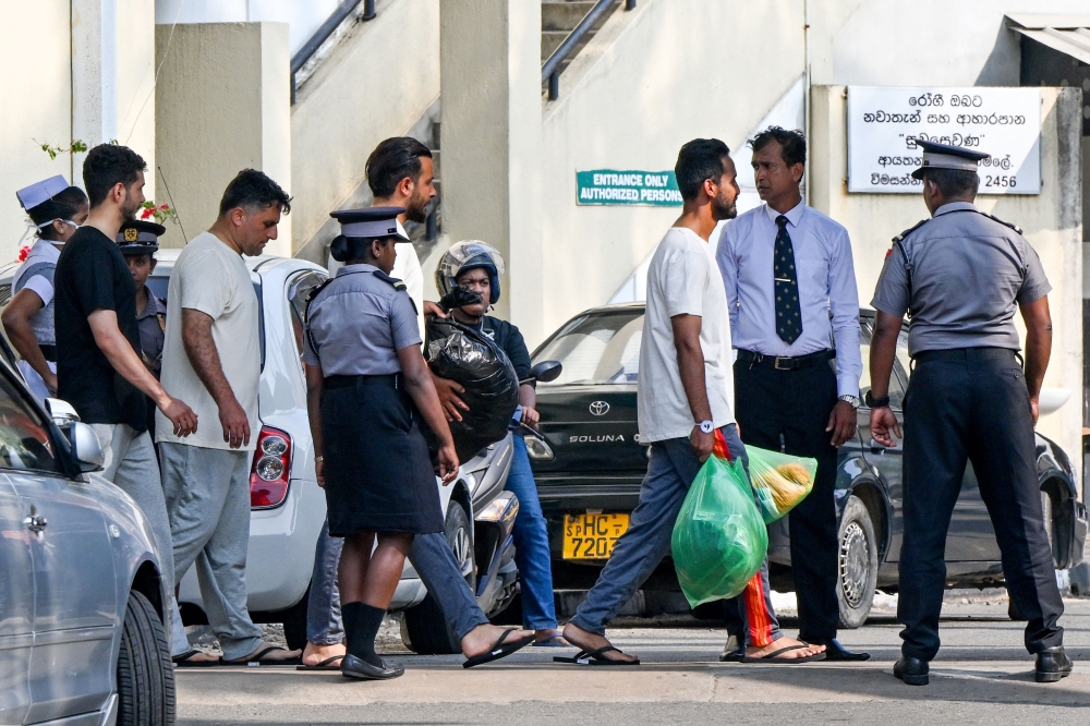 Injured Iranian sailors rescued from their frigate IRIS Dena after a US submarine torpedoed it off Sri Lanka's coast amid the Middle East war, receive treatment at the Karapitiya hospital in Galle. — AFP pic