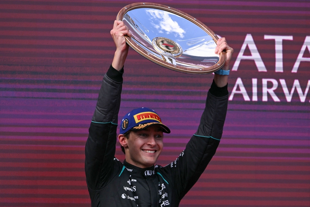 Mercedes' British driver George Russell celebrates on the podium after winning the Australian Grand Prix at the Albert Park Circuit in Melbourne on March 8, 2026. — AFP pic