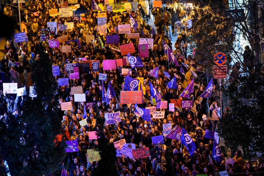 Demonstrators take part in a march marking the International Women's Day near Taksim square in Istanbul yesterday. — AFP pic