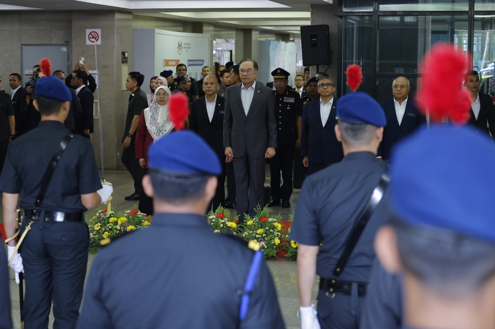 Prime Minister Datuk Seri Anwar Ibrahim attends the Prime Minister’s Assembly with staff of the Ministry of Domestic Trade and Cost of Living (KPDN) in Putrajaya, March 9, 2026. With him is minister Datuk Armizan Mohd Ali. — Bernama pic 