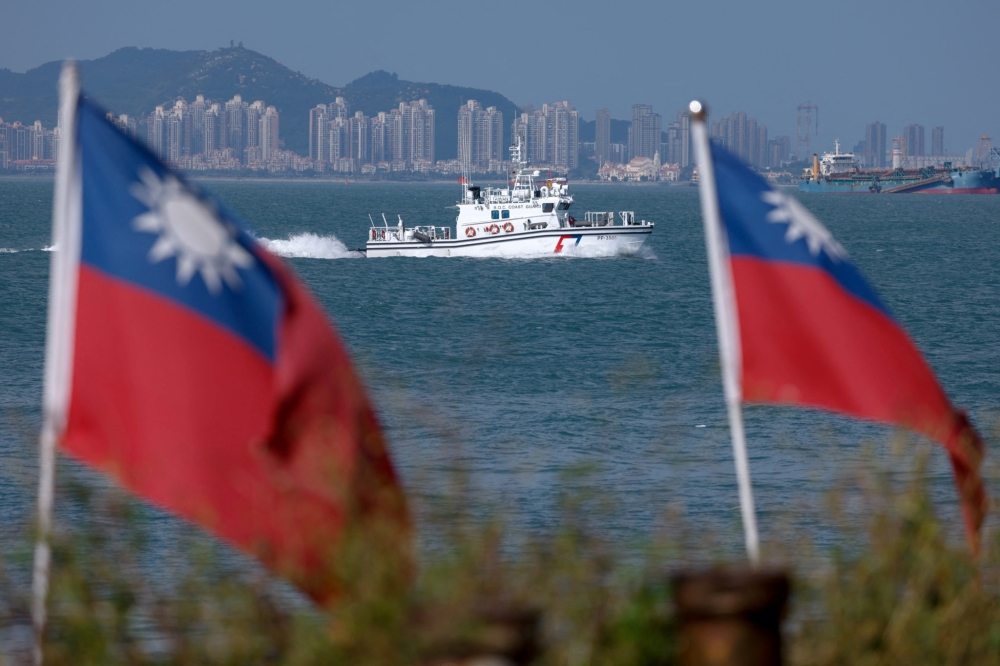 A Taiwan Coast Guard ship patrols near Dadan Island as China's Xiamen is visible in the background, on Dadan Island, in Kinmen, Taiwan October 18, 2025. — Reuters