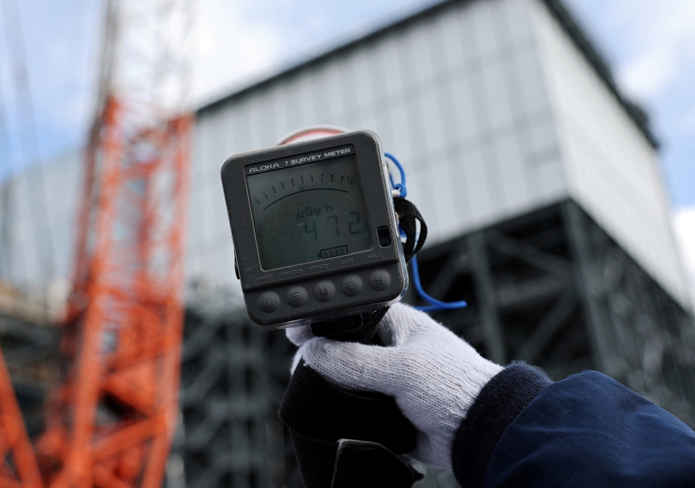 A Geiger counter registers 47.2 microsieverts per hour near the No. 2 reactor building at the tsunami‑crippled Fukushima Daiichi nuclear power plant in Okuma, Fukushima prefecture, Japan, on January 22, 2026. — Reuters pic