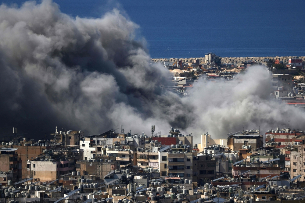 Smoke billows from the site of an Israeli air strike in the southern suburbs of the Lebanese capital, Beirut, on March 9. — AFP pic
